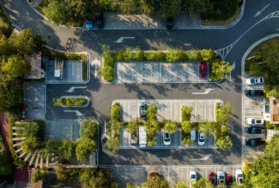 Aerial view of the parking lot in the urban green belt
